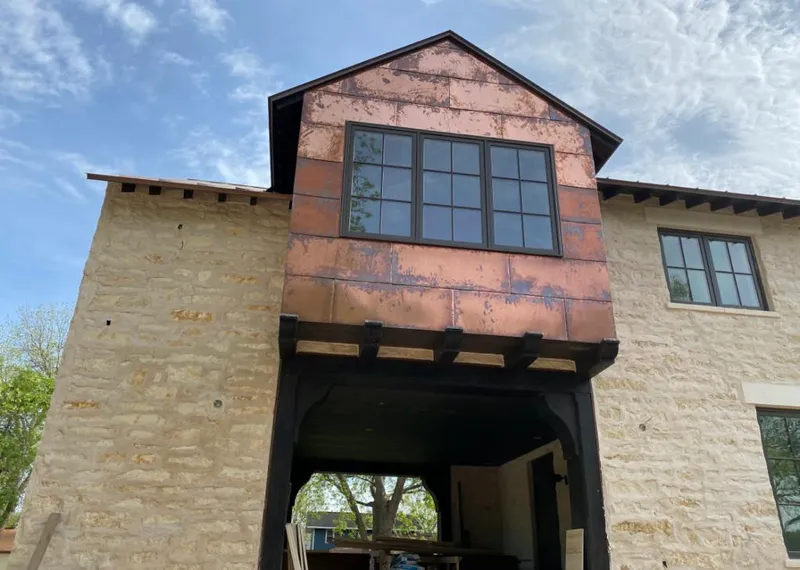Copper metal panel facade on a stone building for Metal Roof Coating in Herndon